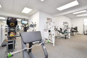 Large gym area with modern commercial equipment